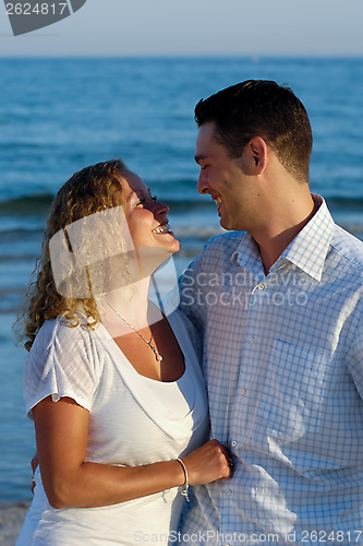Image of Happy young couple at beach