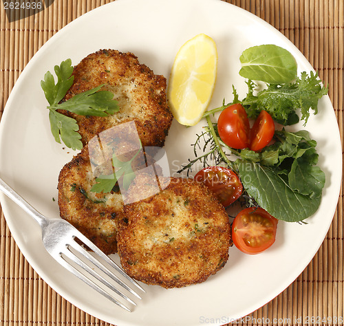 Image of Fish cakes and salad high angle