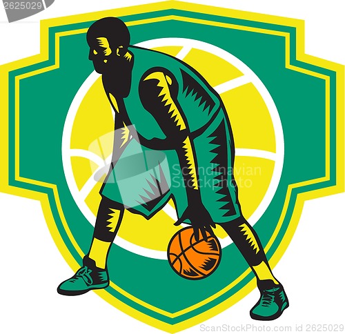 Image of Basketball Player Dribbling Ball Woodcut Shield Retro