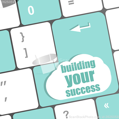 Image of building your success words on button or key showing motivation for job or business