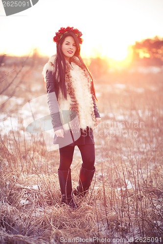 Image of Young woman in fur vest