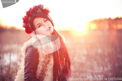 Image of Young woman in fur vest