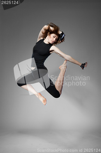 Image of attractive jumping woman