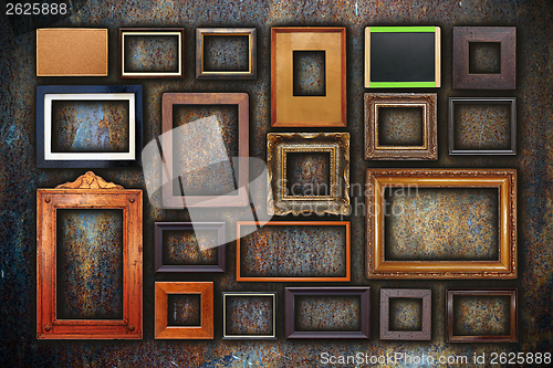 Image of grunge wall full of old frames