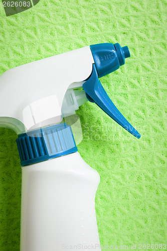 Image of spray on green sponge background