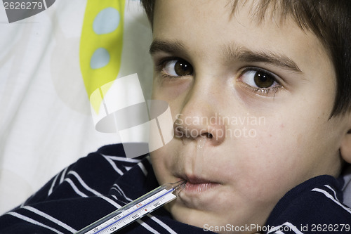 Image of Sick child in bed.