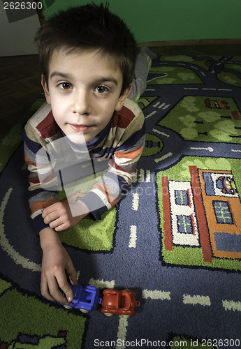 Image of Child is playing with cars