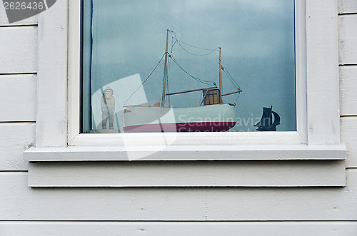Image of Fisherman in a window