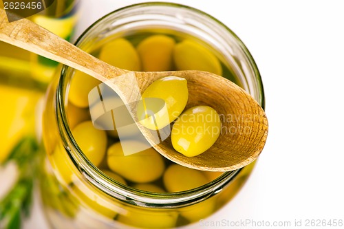 Image of Close up green olives in bank