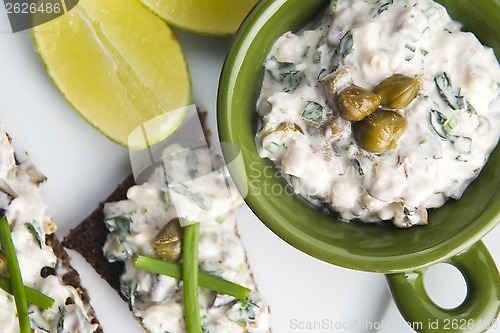 Image of sandwiches with dark bread, herrings, mushrooms, pepper