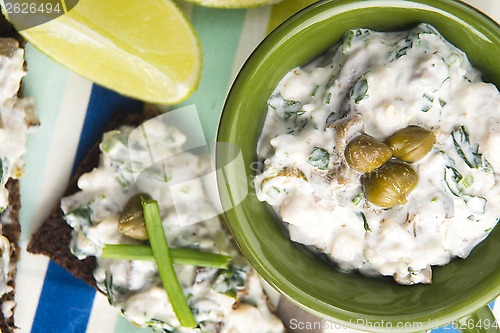 Image of sandwiches with dark bread, herrings, mushrooms, pepper