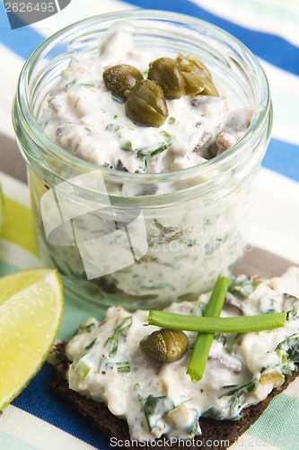 Image of sandwiches with dark bread, herrings, mushrooms, pepper