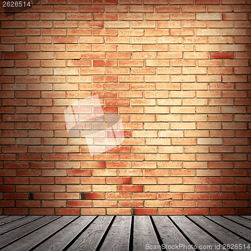Image of red brick wall and wooden floor