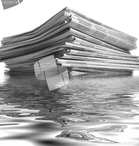 Image of sinking stack of newspapers