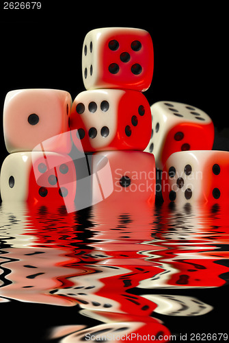 Image of sinking pile of red illuminated white dice