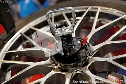 Image of Automatic robot repairing wheel closeup