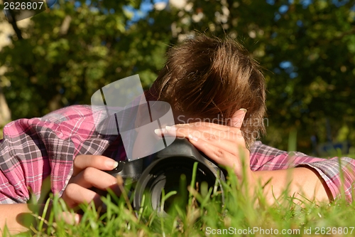 Image of My beloved one taking photos on the ground