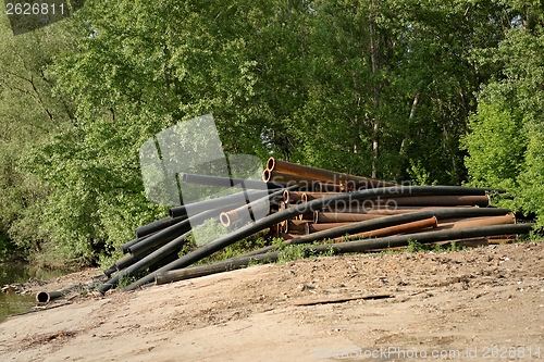 Image of Rusty metal pipes in the forest