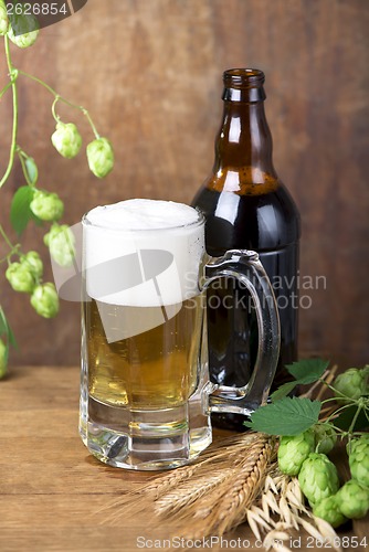 Image of glass beer on wood background