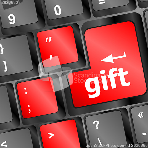 Image of Computer keyboard with gift key - business background