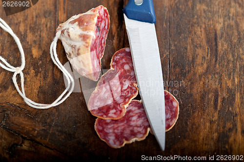 Image of italian salame pressato pressed slicing