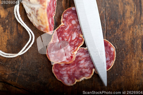 Image of italian salame pressato pressed slicing