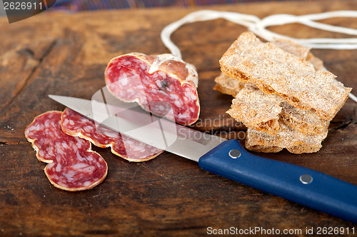 Image of italian salame pressato pressed slicing