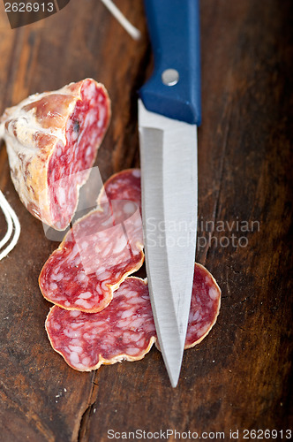 Image of italian salame pressato pressed slicing