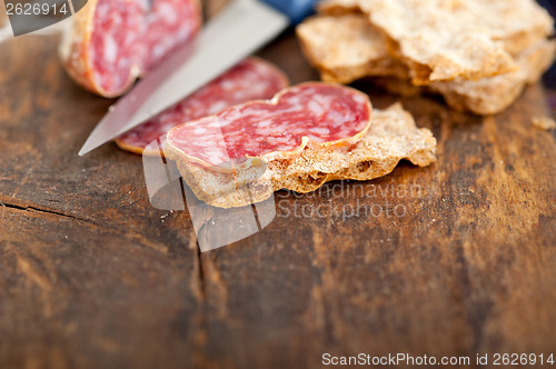 Image of italian salame pressato pressed slicing