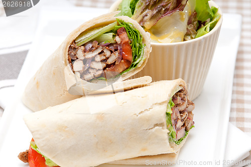 Image of kafta shawarma chicken pita wrap roll sandwich