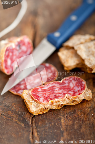 Image of italian salame pressato pressed slicing