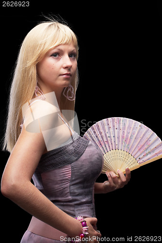 Image of Beautiful young woman with fan