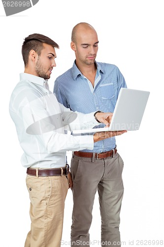 Image of Two businessmen consulting a laptop