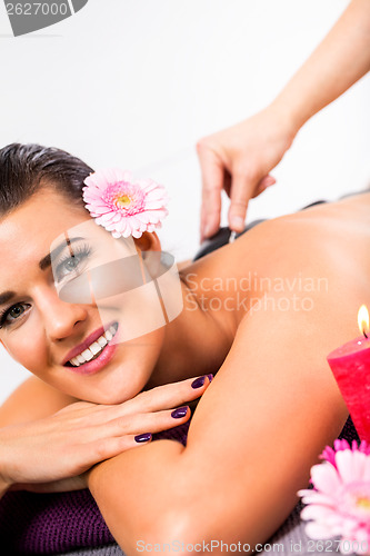 Image of Beautiful woman having a back massage