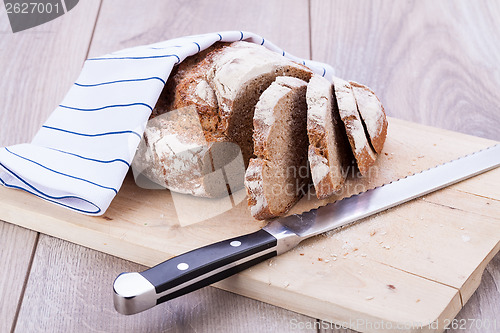 Image of homemade fresh baked bread and knife 