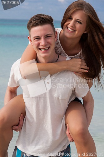 Image of smiling young couple having fun in summer holiday