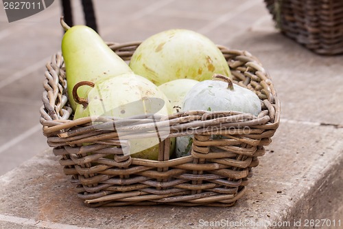 Image of Fresh ripe pears in a wicker basket