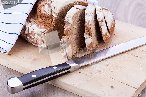 Image of homemade fresh baked bread and knife 