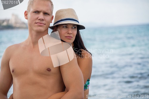 Image of smiling young couple having fun in summer holiday