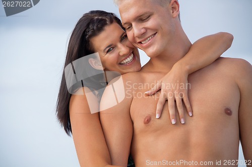 Image of smiling young couple having fun in summer holiday