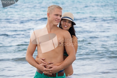 Image of smiling young couple having fun in summer holiday