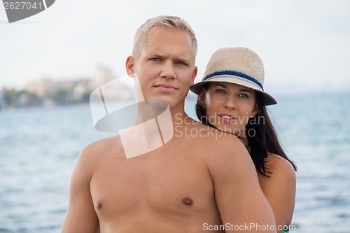 Image of smiling young couple having fun in summer holiday