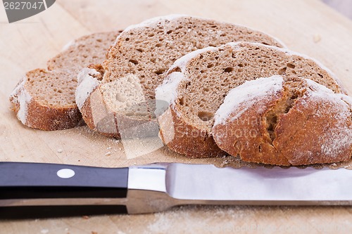 Image of homemade fresh baked bread and knife 