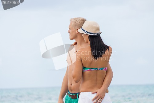Image of smiling young couple having fun in summer holiday