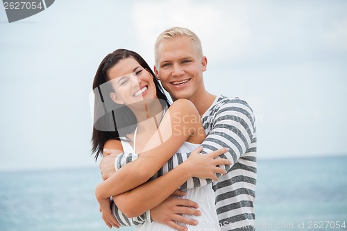 Image of smiling young couple having fun in summer holiday