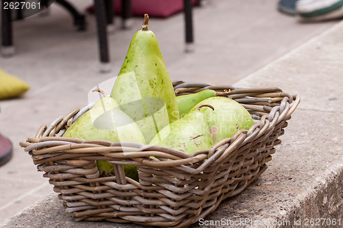 Image of Fresh ripe pears in a wicker basket