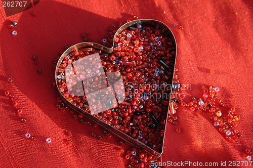 Image of red heart on red silk