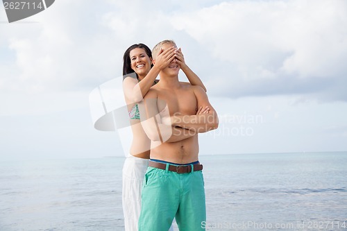 Image of smiling young couple having fun in summer holiday