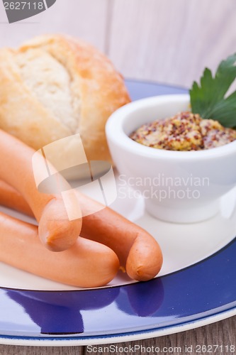 Image of tasty sausages frankfurter with grain bread 