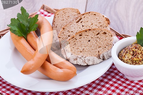 Image of tasty sausages frankfurter with grain bread 